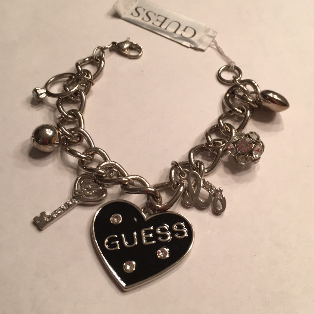 NWT Guess silver tone metal multi charm bracelet